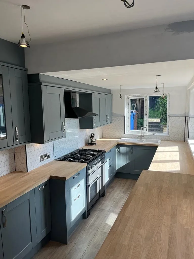 Blue-grey kitchen with oak worktops by AG Joinery Lancashire