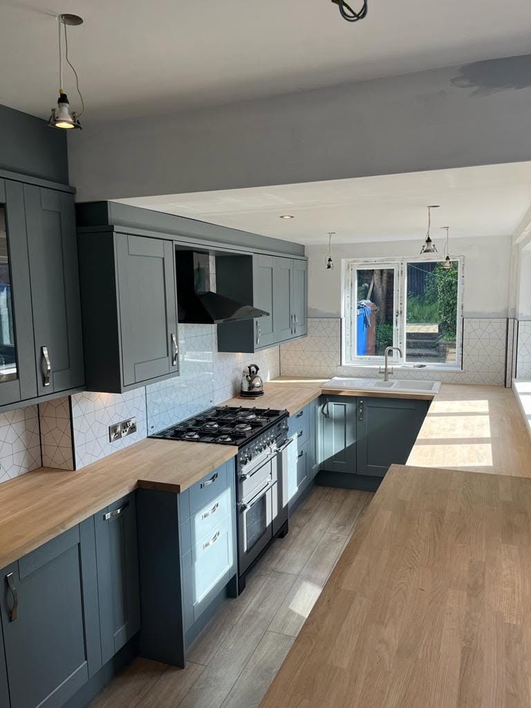 Blue-grey shaker kitchen with oak worktops fitted by AG Joinery in Blackburn