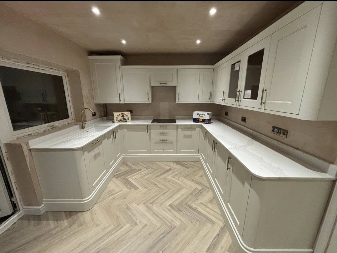 Completed kitchen by AG Joinery Blackburn with herringbone flooring and LED plinth lighting